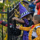 masked children trick or treaters receiving candy